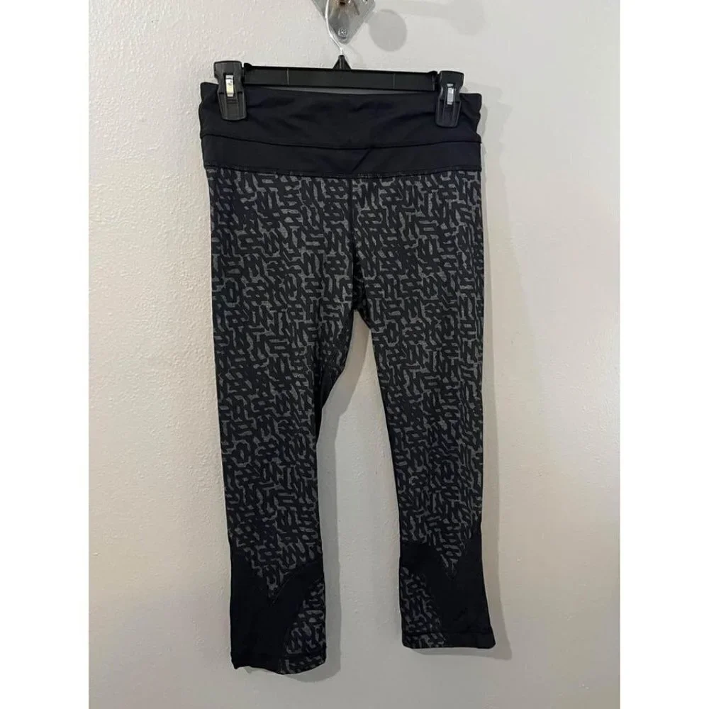 Lululemon Black net Print Run Inspire Crop II Block it Pocket Leggings Size 6
